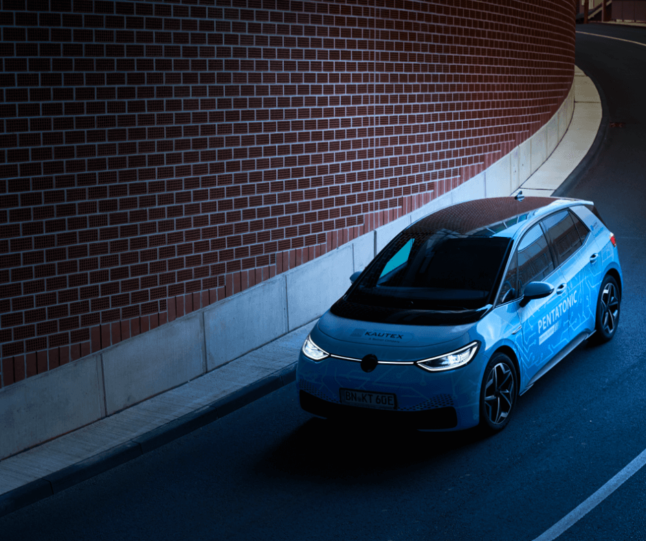 car turning around a brick wall