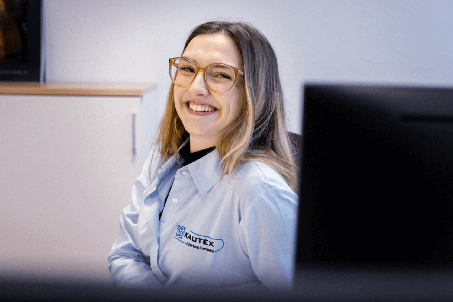 Woman sitting in front of a computer